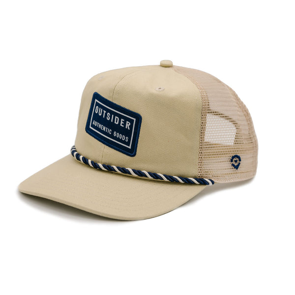 Khaki tan front panel and flat hat brim with Black Tilt Outsider patch